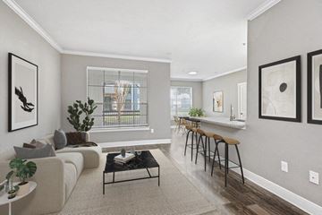 Houston apartment for rent - a living room with a couch and a bar