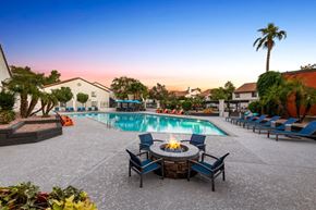 Phoenix apartment for rent - a swimming pool with a fire pit and chairs around it at Lore South Mountain, Phoenix