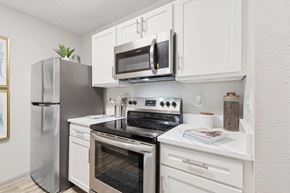 Jacksonville apartment for rent - Model kitchen with stainless steel appliances at Mirage on Kernan Apartments in Jacksonville, FL
