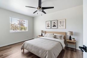 Carlsbad apartment for rent - A bedroom with a large bed and a ceiling fan.