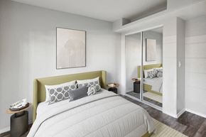 Tucson apartment for rent - a bedroom with a large bed and a mirror