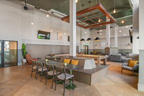 West Valley City apartment for rent - A modern dining area with a long table and chairs.