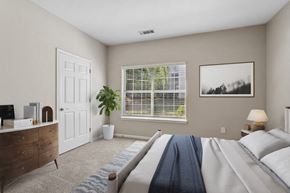 Stockbridge apartment for rent - Bedroom with a large bed and a window