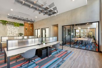 Co-working space (lounge, open desks, work pods, print station, coffee bar, & conference room)
