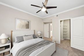 Dallas apartment for rent - Model Bedroom with Carpet and Walk In Closet at Allure North Dallas Apartments located in Dallas, TX.