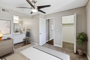 Chandler apartment for rent - a bedroom with a bed and a ceiling fan