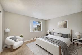 Renton apartment for rent - Model Bedroom with Carpet and Window View at Grammercy Apartments located in Renton, WA.
