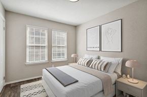 Marietta apartment for rent - 1-Bedroom Apartments in Marietta, GA - Laurel Hills Preserve - A Bedroom With Matching Nightstands And Lamps, Wall Art Above The Headboard, And Two Windows With White Blinds.