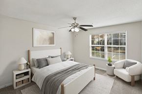 Riverdale apartment for rent - Model Bedroom with Carpet and Window View at Shadow Ridge Apartments in Riverdale, GA.