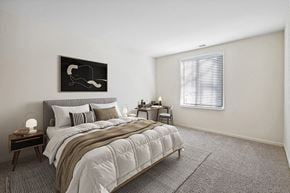 Silver Spring apartment for rent - Apartments for Rent in Silver Spring, MD - Spring Parc - Bright Bedroom With Upholstered Bed, Neutral Bedding, Side Tables, Desk Nook, And Wide Window With Blinds Over Plush Carpet