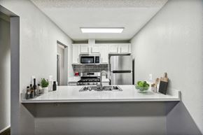 Fullerton apartment for rent - Model kitchen with stainless steel appliances