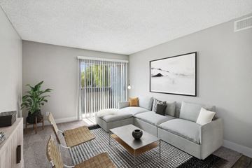 Las Vegas apartment for rent - the living room of an apartment with a couch and a table