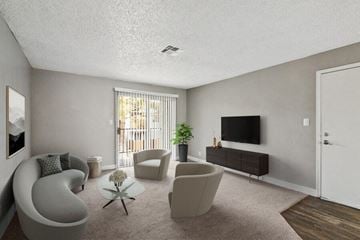 Las Vegas apartment for rent - a living room with a couch and chairs and a television