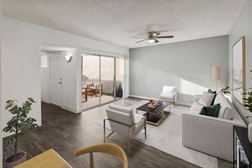 Tucson apartment for rent - a living room with a couch and a ceiling fan