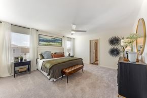 Pflugerville apartment for rent - 3 Bedroom Single Family Homes for Rent in Pflugerville, TX - Banyan Everton - Bedroom With Plush Carpet, Large Windows, Ceiling Fan, And Upholstered Bed