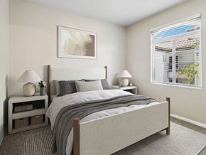 Moreno Valley apartment for rent - A bedroom with a large bed and two lamps.