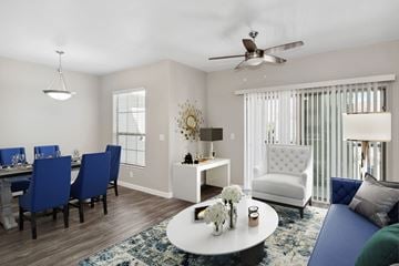 North Las Vegas apartment for rent - A living room with a dining table and chairs.