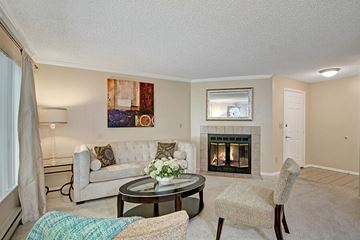 Federal Way apartment for rent - A living room with a fireplace and a painting on the wall.