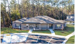 Satsuma apartment for rent - A house with a parking lot in front of it at Arbours at Satsuma Apartments, Mobile, Alabama