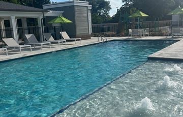 Lafayette apartment for rent - A pool with a fountain in the middle of it.