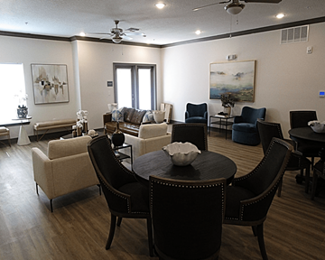 Alachua apartment for rent - A living room with a dark brown table and chairs.