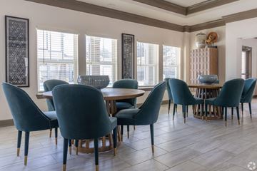 Villa Rica apartment for rent - A dining room with blue chairs and a wooden table.