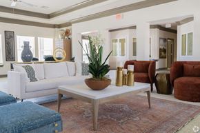 Villa Rica apartment for rent - A living room with a white couch, a coffee table, and a rug. at Arbours at Villa Rica, LLC, Georgia