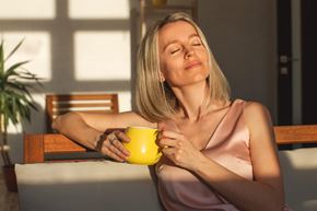 Cocoa apartment for rent - A woman in a pink dress is holding a yellow mug at Arbours at Cocoa Landing, Cocoa, 32926