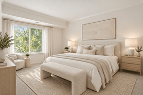 Annapolis apartment for rent - A bedroom with a large bed, a chair, and a potted plant.