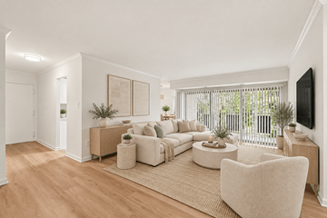 Annapolis apartment for rent - A living room with a white couch and a white chair.