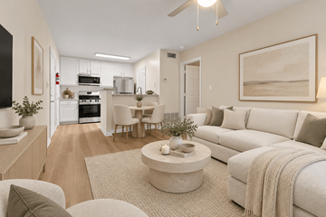 Fairfax apartment for rent - A modern living room with a white sofa and a coffee table.