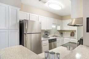 Ridgeland apartment for rent - Kitchen with refrigerator at Arbors at Natchez Trace Apartments, Ridgeland, MS
