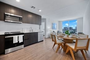 Miami apartment for rent - a kitchen and dining room with a table and chairs