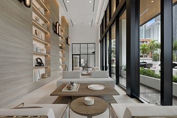 Miami apartment for rent - a living room with a couch and a table