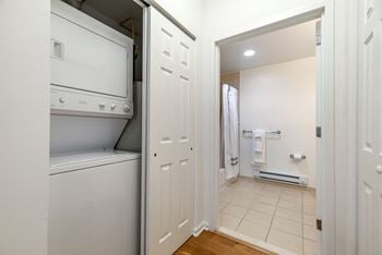 Laundry closet with stacked washer and dryer