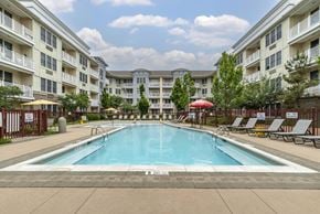 Long Branch apartment for rent - Outdoor swimming pool with lounge seating and umbrellas at Pier Village Apartments, Long Branch, 7740
