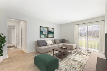 Rosedale apartment for rent - A living room with a couch, a coffee table, and a painting on the wall.