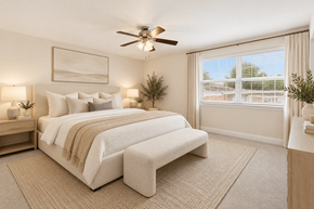 Chatham apartment for rent - A bedroom with a large bed and a ceiling fan.