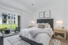 East Hanover apartment for rent - a bedroom with a large bed and a sliding glass door