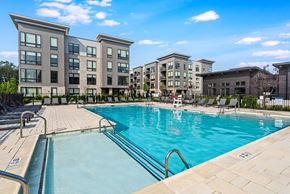 East Hanover apartment for rent - A swimming pool in front of apartment buildings.