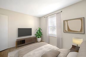 Frederick apartment for rent - Bedroom with wall mounted tv and modern media console at The at Hunters Glen Apartments, Frederick, 21702