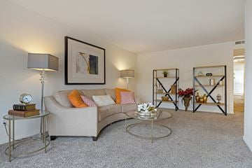 Ridgeland apartment for rent - A living room with a grey couch, a coffee table, and a painting on the wall.
