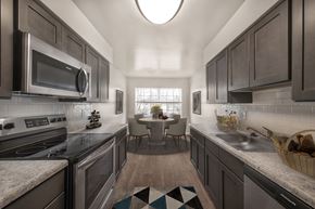 Owings Mills apartment for rent - Kitchen with mosaic tiles and cabinets at The Apartments at Owings Run, Maryland, 21117