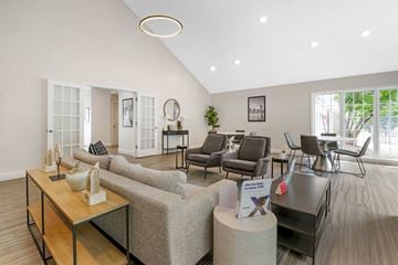 Owings Mills apartment for rent - A living room with a grey sofa and a wooden coffee table.