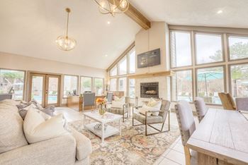 A living room with a fireplace and a television