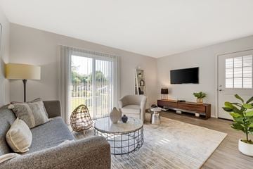 Plainsboro Township apartment for rent - a living room with a couch and a chair and a tv