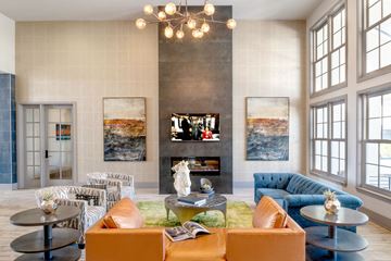 Lafayette apartment for rent - a living room with couches and tables and a fireplace