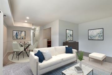 Cockeysville apartment for rent - A living room with a white couch and a coffee table.