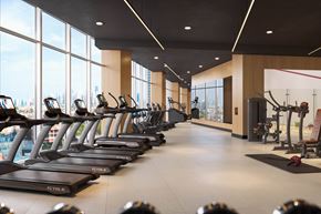 Jersey City apartment for rent - A gym with treadmills and a view of the city.