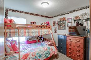 Michigan Center apartment for rent - a bedroom with bunk beds and a dresser with a tv